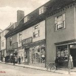 Fore Street. Mr Hill at the door of his bakers shop with his Grandchildren. Mr Hill at the door of his bakers shop with his Grandchildren.